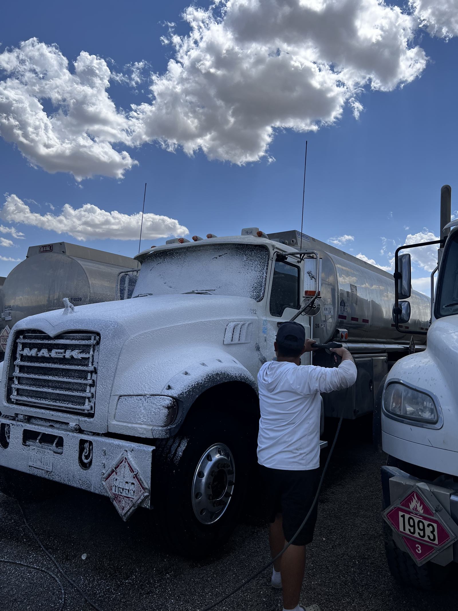 Foam wash application on a Mack tanker truck cab